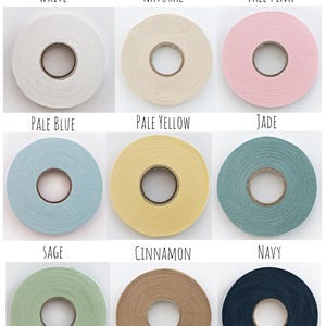 May include: A collection of chenille-it yarn in various colors, including white, natural, pale pink, pale blue, pale yellow, jade, sage, cinnamon, and navy.