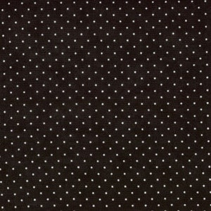 May include: Black fabric with a white polka dot pattern.