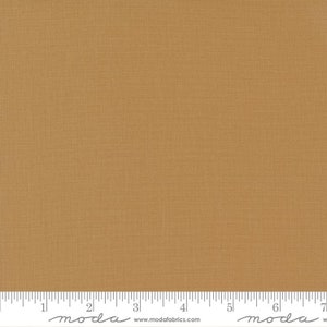 May include: A solid brown fabric with a subtle woven texture. The fabric is shown with a ruler marked in inches.