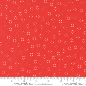 May include: Red fabric with a white dotted circle pattern. The fabric is 44 inches wide and is perfect for quilting, crafts, and home decor projects.