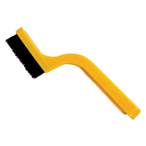 May include: A yellow plastic brush with black bristles. The brush has a curved handle.