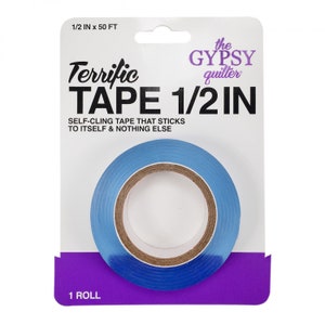 May include: A roll of blue self-cling tape labeled "Terrific Tape 1/2 IN" by "the GYPSY quilter". The tape is 1/2 inch wide and 50 feet long.