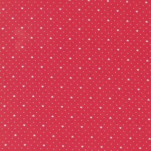 May include: Red fabric with a white polka dot pattern of small hearts.