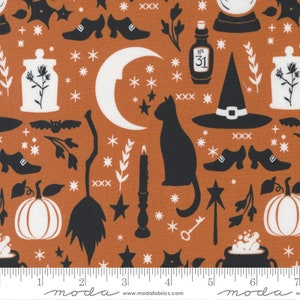 May include: A brown fabric with a white and black repeating pattern of Halloween themed imagery. The pattern includes a crescent moon, stars, a witch's hat, a broom, a cat, a cauldron, a pumpkin, a bottle with the number 31 on it, and a jar with a plant inside. The fabric has a ruler with the numbers 1 through 7 printed on it.