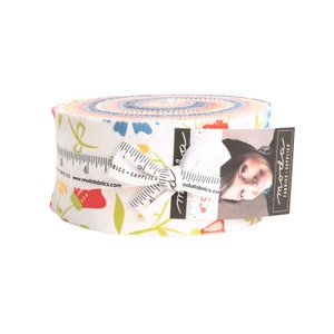 May include: A Moda Fabrics charm pack featuring a white background with colorful floral designs. The pack includes 42 - 2.5 inch squares of fabric. The Moda Fabrics logo and website are printed on the label.