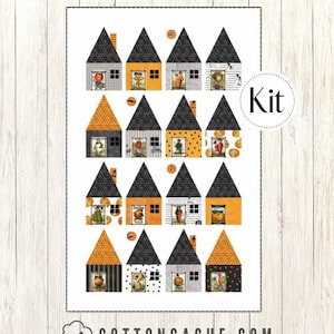 May include: A fabric panel featuring a repeating pattern of stylized houses with orange and black accents. Each house has a black roof and a unique facade design, with small illustrations in the windows. The word "Kit" is in a white circle.