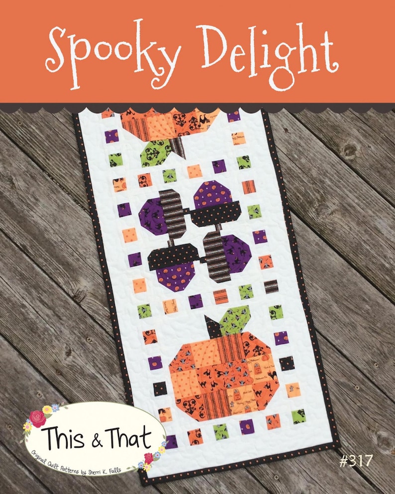 May include: A quilting pattern for a table runner featuring a Halloween theme with pumpkins, bats, and ghosts. The pattern is called "Spooky Delight" and is from the "This & That" collection by Sherri K. Falls. The pattern number is #317.