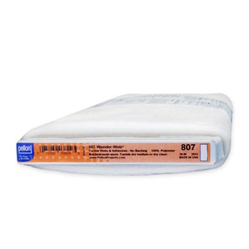 May include: A white roll of Pellon Wonder-Web fusible web adhesive, 807, 20 in x 29.5 in, made in the USA.