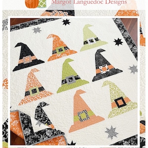May include: A quilt pattern featuring a white background with nine witch hats in various colors and patterns. The hats are arranged in a grid pattern. The quilt is surrounded by a black and white border. The text "Be Witched" and "www.thepatternbasket.com" is printed below the quilt.