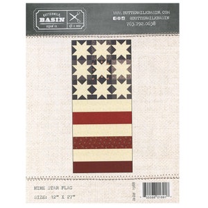 May include: Nine Star Flag quilting pattern by Buttermilk Basin Design Co. The pattern features a red, white, and blue American flag design with a nine-star block in the upper left corner. The pattern is 12 inches by 27 inches.