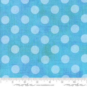 May include: Blue fabric with a white polka dot pattern. The fabric has a textured, slightly distressed look.