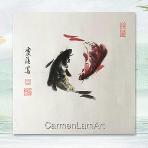 May include: Watercolor painting of two koi fish in black and red, swimming in opposite directions. The artwork features Chinese calligraphy and red stamps. The artist's name, CarmenLamArt, is at the bottom.