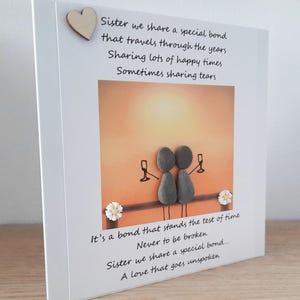 May include: A card with a poem about sisterhood. The poem reads "Sister we share a special bond that travels through the years. Sharing lots of happy times. Sometimes sharing tears. It's a bond that stands the test of time. Never to be broken. Sister we share a special bond... A love that goes unspoken."