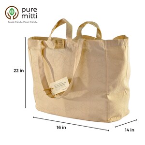 May include: A large, beige canvas tote bag with two handles. The bag is 22 inches tall, 16 inches wide, and 14 inches deep. The bag has a small brown tag attached to one of the handles that says "Pure Mitti" and "This product is hand made by skilled workers in India".