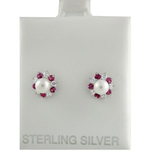 May include: Sterling silver earrings with a pearl centre and a halo of pink and white stones.