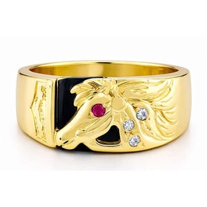 Puede incluir: Una taza de cerámica blanca con un asa negra y el texto "But First, Coffee" en negro, con una fuente de estilo manuscrito. La taza está sobre una superficie blanca.