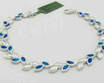 May include: A silver bracelet with blue opal stones set in leaf-shaped designs.