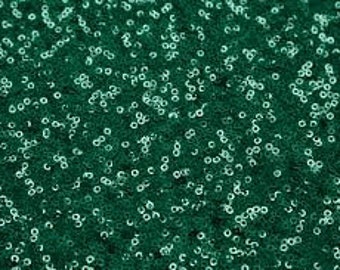May include: Teal green fabric covered in small, round sequins.