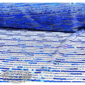 May include: Blue sequined fabric with a gradient of blue sequins on a sheer mesh base. The sequins are arranged in horizontal lines. The fabric is perfect for making dresses, skirts, tops, and other garments.