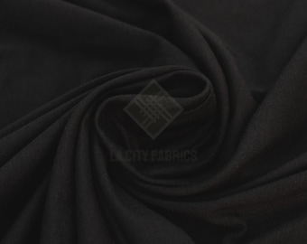 Tecido de malha jersey preta em algodão com elastano, vendido por metro, com elasticidade em quatro direções, ideal para confecção de roupas, camisas e vestidos. Largura de 152 cm (60 polegadas).