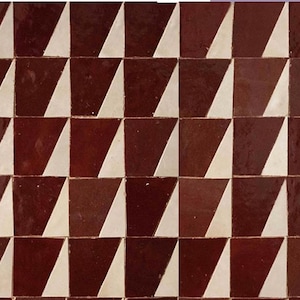 May include: A repeating pattern of white and maroon triangular tiles. The tiles are arranged in a staggered pattern, creating a geometric design.