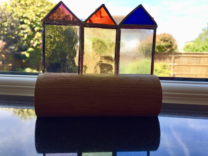 Stained glass beach huts in oak block