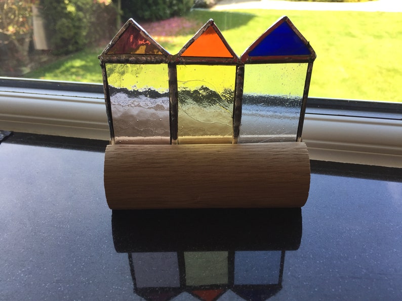 Stained glass beach huts in oak block