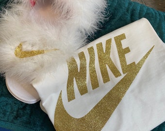 red and white fuzzy nike slides