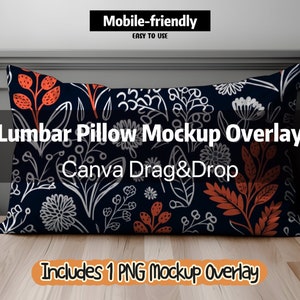 May include: A mockup of a lumbar pillow with a floral pattern in shades of white, orange, and black on a dark blue background. The text "Lumbar Pillow Mockup Overlay" and "Canva Drag&Drop" is displayed on the pillow. The text "Includes 1 PNG Mockup Overlay" is displayed below the pillow.