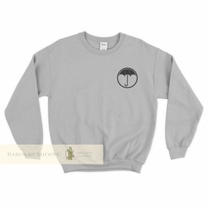 The Umbrella Academy Sweatshirt The Umbrella Academy shirt Umbrella Academy Logo Sweater Pocket patch Crest Pin Poster Ut Malum Pluvia Tee