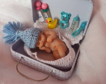 Polymer clay newborn with his travel basket, miniature baby with grooming accessories, small ooak doll, BLUE hat baby