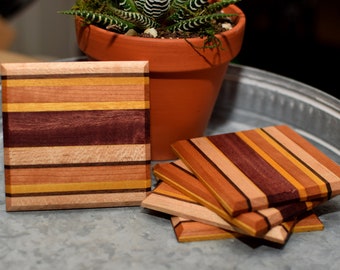 Wooden coasters of various woods. Set of four handmade wood coasters.