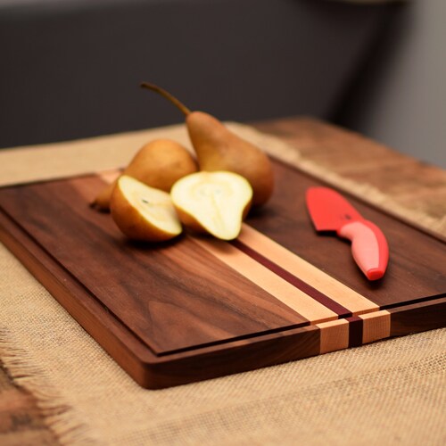 Dark Walnut cutting board with juice groove and decorative Maple stripes. Solid hard wood chopping block. shops Perfect foodie gift.
