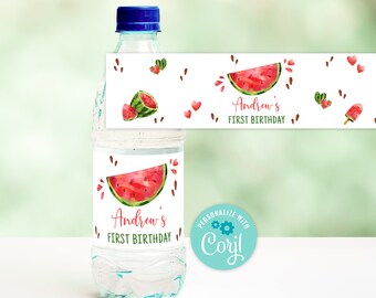 May include: Water bottle label with a watermelon design. The label says "Andrew's First Birthday" and has a watermelon slice, seeds, and hearts. The label is personalized with "Cori!"