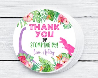 May include: Round thank you sticker with a pink dinosaur, purple dinosaur, and tropical flowers. The sticker says "Thank You for Stomping By! Love, Ashley".