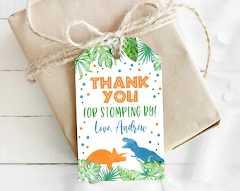 May include: A white thank you tag with green leaves, orange and blue dinosaur silhouettes, and colorful confetti. The text reads "Thank You for Stomping By! Love, Andrew".