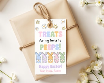 May include: A white gift tag with a colorful Easter theme. It says "Treats for my favorite peeps!" with a row of five pastel-colored cartoon bunnies. The tag also says "Happy Easter!" and "Your friend, Ashley."
