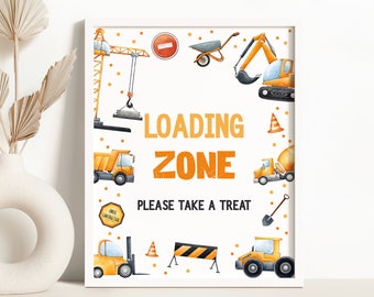 May include: A printable sign with a white background and orange and black construction vehicles. The sign says "Loading Zone" and "Please take a treat".