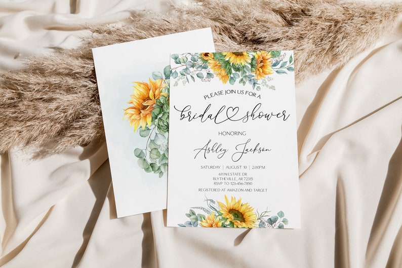May include: A sunflower-themed bridal shower invitation with a watercolor design. The invitation features sunflowers, eucalyptus leaves, and the text "Please join us for a bridal shower honoring Ashley Jackson". The invitation also includes the date, time, address, RSVP information, and registry details.