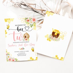 May include: A pink and yellow bee-themed invitation for a second birthday party. The invitation features a bee, a honeycomb, a beehive, and flowers. The text on the invitation reads "So sweet to bee two. Please join us as we celebrate Sophie's 2nd Bee-Day. Saturday, August 10 | 2:00PM. 501 N. Estate Dr. Blytheville, AR 72315. RSVP to 123-456-7890."