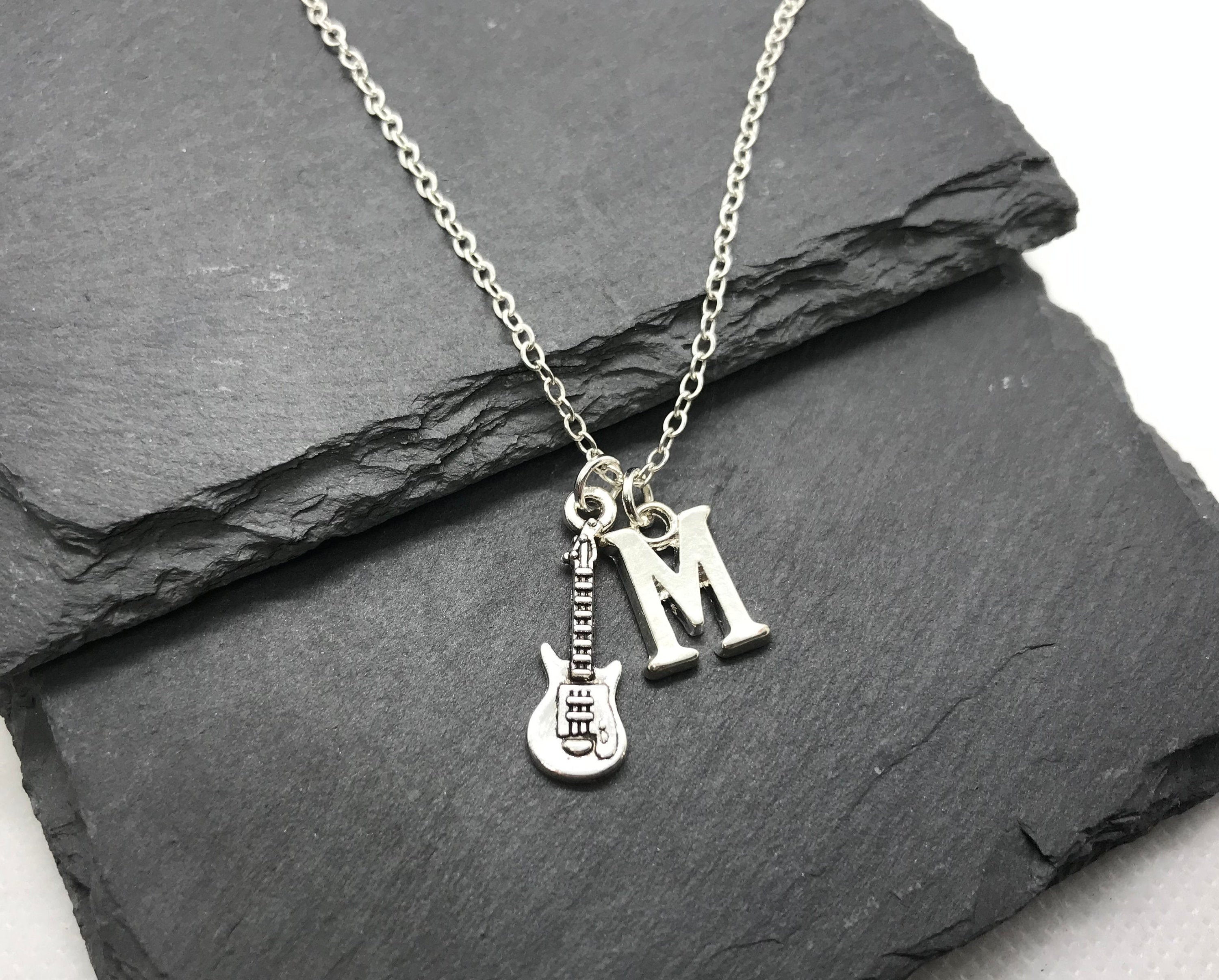 アクセサリー BWL hard rock hotel guiterpick pendant $_12.JPG