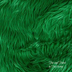 May include: A close-up of a plush, green faux fur fabric. The fabric has a soft, fluffy texture and is perfect for crafting projects, home decor, and more.