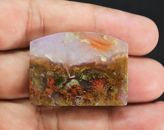 May include: A polished, flat-topped, rectangular-shaped moss agate gemstone featuring a translucent lavender base with intricate, branching inclusions in shades of deep forest green, earthy brown, and vibrant orange-red throughout the stone.