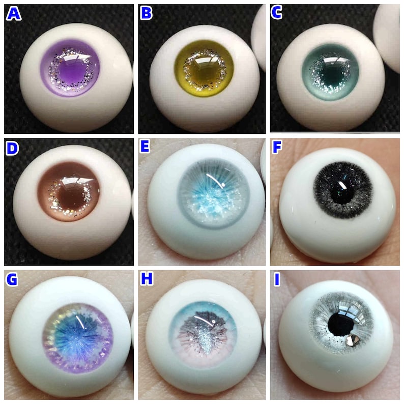 May include: Nine different coloured glass eyes for doll making. The eyes are all round and have a white base with a coloured iris and a black pupil. The irises are purple, yellow, teal, brown, blue, black, iridescent blue, pink and silver.