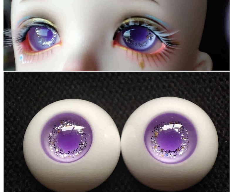 May include: Two purple and silver doll eyes with a white iris and a sparkly purple pupil.
