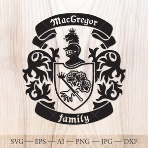 May include: Black and white silhouette of a coat of arms with the text "MacGregor family". The coat of arms features a knight's helmet, a sword, and a tree with leaves.