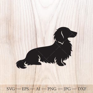 May include: A black silhouette of a long-haired dachshund dog in profile. The dog is depicted sitting, with its tail curled and head facing right. The image is set against a light wood grain background.