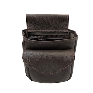 May include: A brown leather tool pouch with a flap and multiple pockets. The pouch is open and empty.