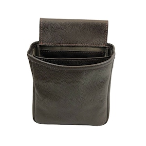 May include: A brown leather pouch with a flap top and multiple compartments. The pouch is open and the interior is visible.