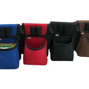 May include: Four different colored canvas bags with a single large pocket and two smaller pockets on the top. The bags are blue, red, black, and brown.